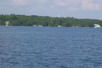 From the lake, looking East, can faintly see the Church Steeple above the trees as a white triangle